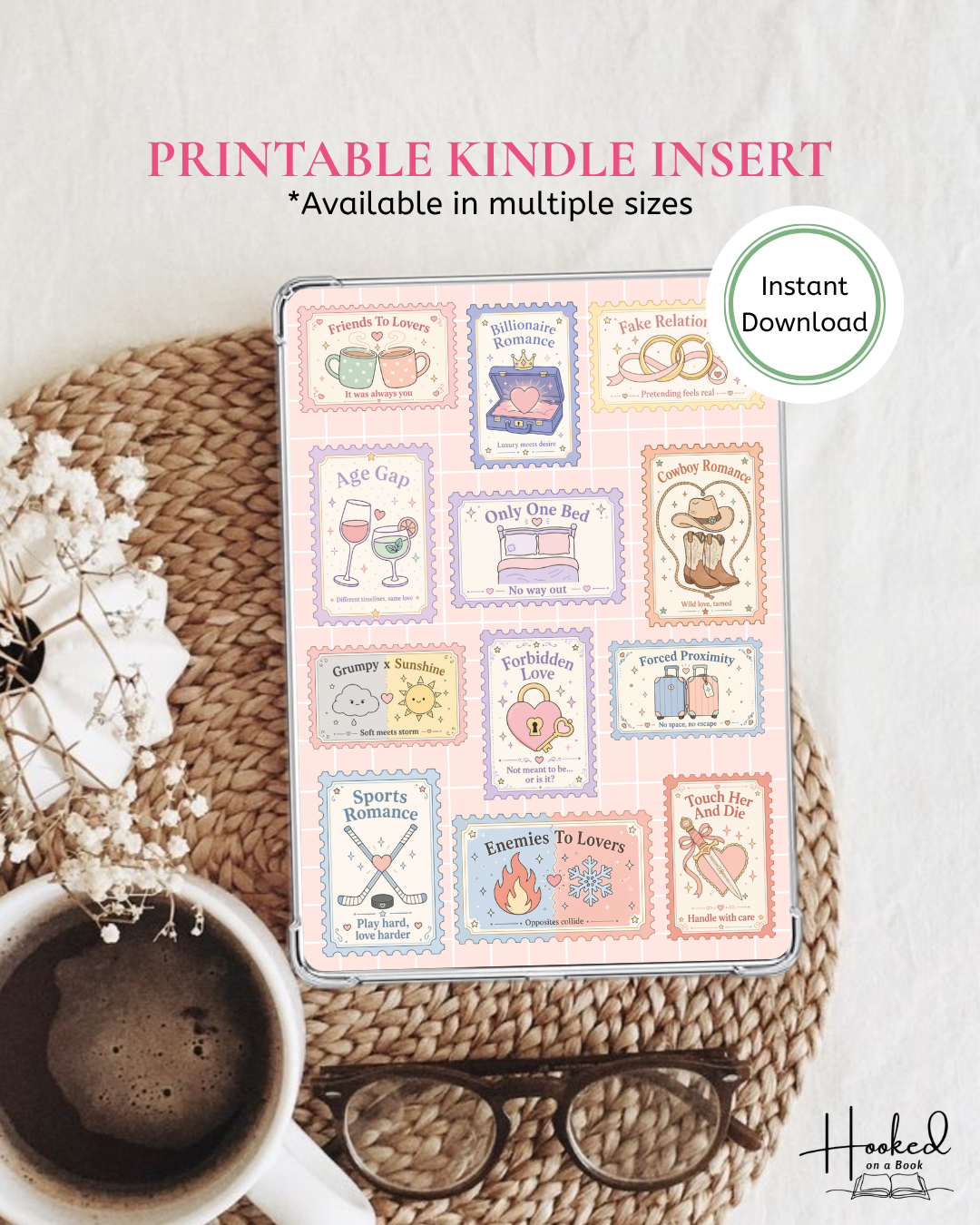 Printable Kindle insert of a collage of bookish tropes stamps resting on a mat with coffee cup and glasses on a textured surface