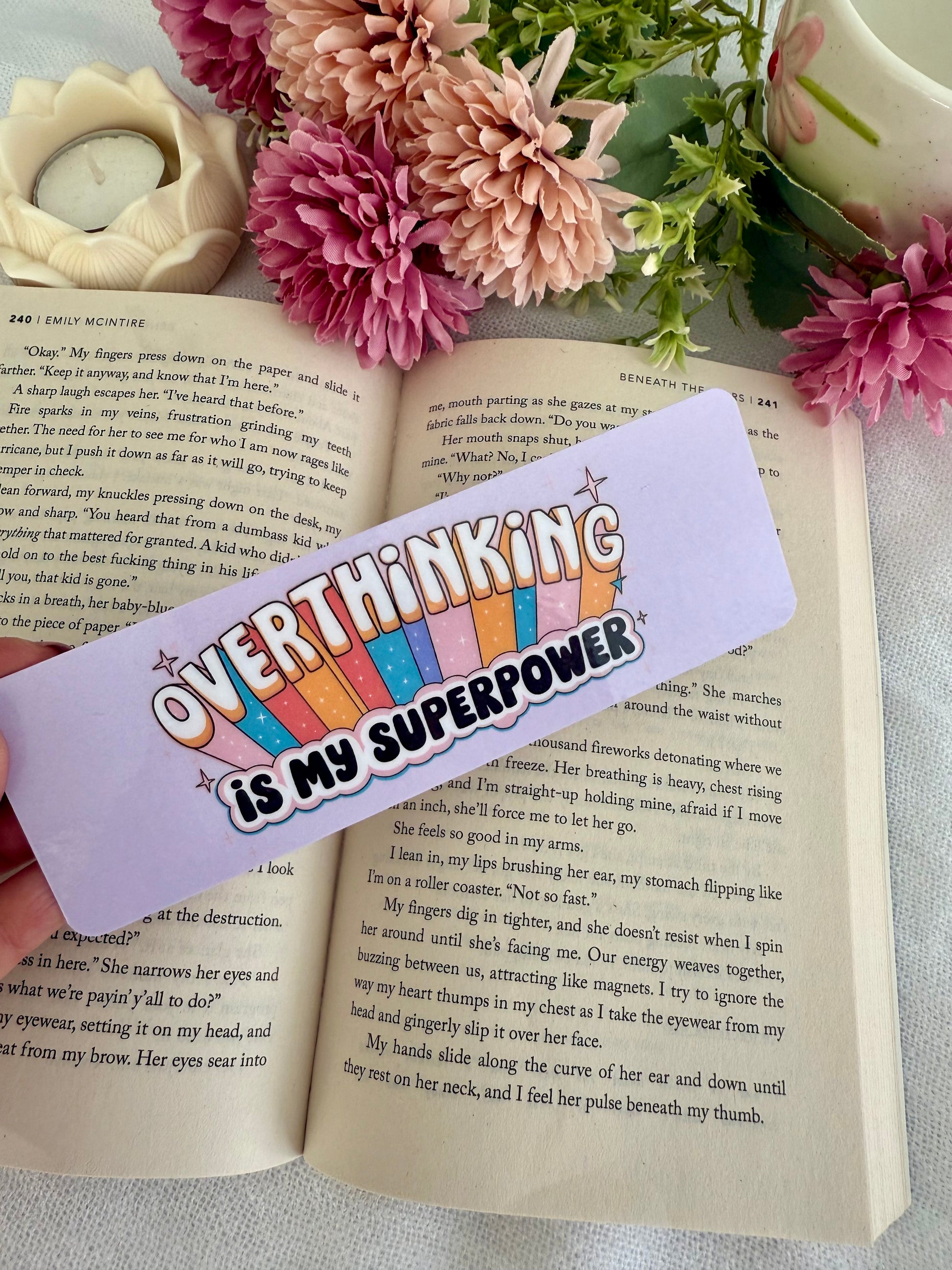 Bookmark with 'Overthinking is my superpower' text on an open book with flowers.