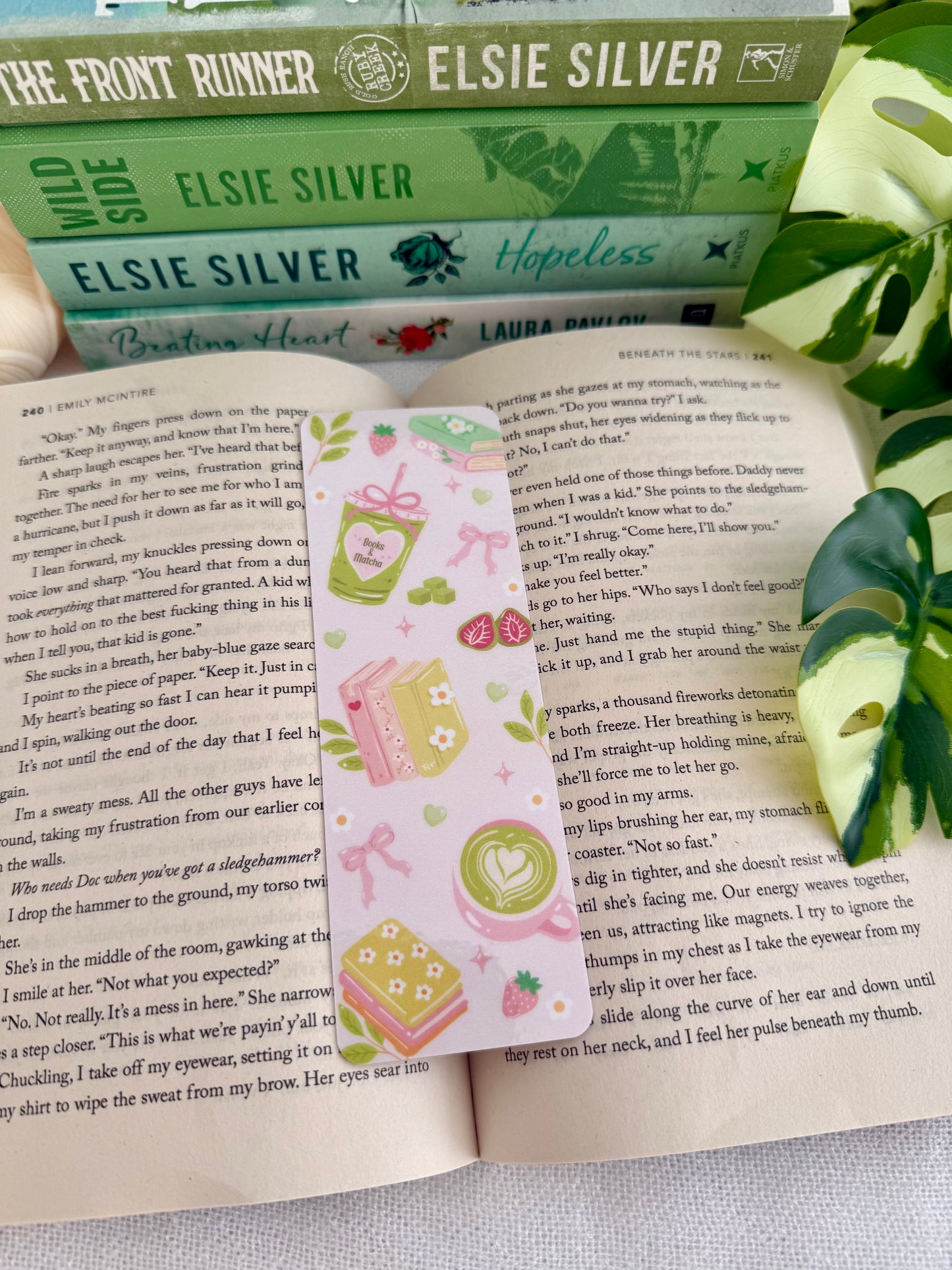 Bookmark with matcha and books design. Bookmark is placed on an open book.