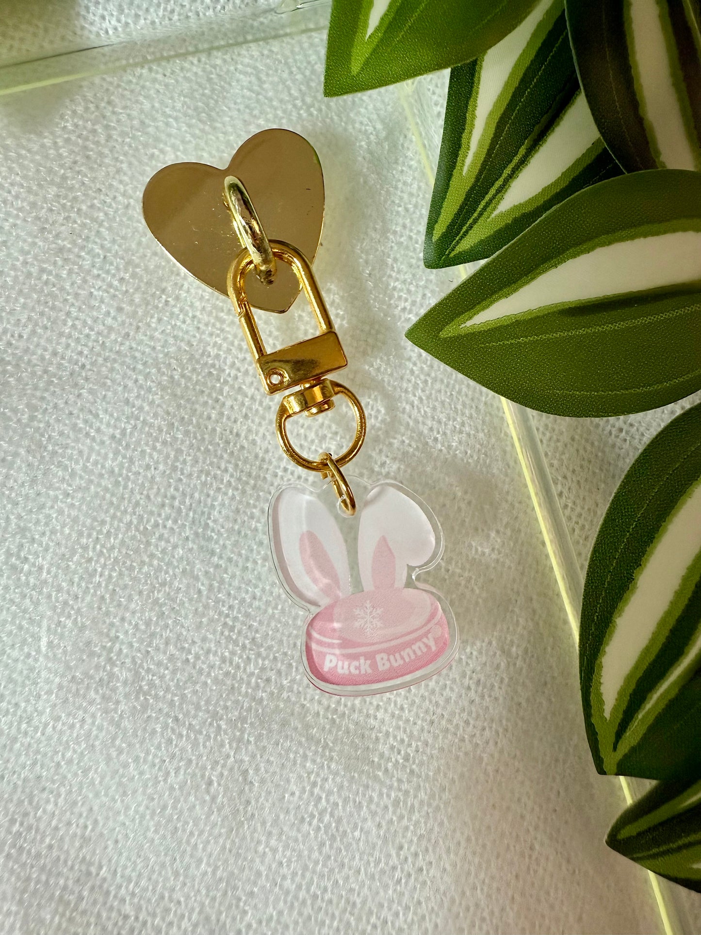 Keychain with pink bunny design on a white background